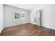 Bedroom features hardwood floors, white walls, and natural light from the backyard at 2690 Old Hickory Nw Dr, Marietta, GA 30064