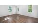 Bedroom features hardwood floors, white walls, and windows allowing natural light at 2690 Old Hickory Nw Dr, Marietta, GA 30064