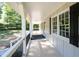 Inviting covered porch overlooking a lush green yard at 2690 Old Hickory Nw Dr, Marietta, GA 30064