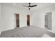 Spacious bedroom featuring carpet floors, two closets, and an ensuite bathroom at 3072 Kelly St, Scottdale, GA 30079