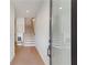 Hallway features wood floors, natural light, chair, and staircase at 3072 Kelly St, Scottdale, GA 30079