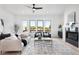 Cozy living room with fireplace, large windows, and modern decor creating an inviting atmosphere at 3072 Kelly St, Scottdale, GA 30079