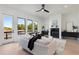 Bright and airy living room featuring a fireplace, modern decor, and an adjacent outdoor balcony at 3072 Kelly St, Scottdale, GA 30079