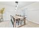 Elegant dining room with wood table and modern lighting at 4083 Audubon Dr, Marietta, GA 30068