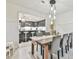 Bright dining area with farmhouse table and view to kitchen at 4083 Audubon Dr, Marietta, GA 30068