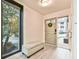 Bright and airy entryway with a bench and view to the backyard at 4083 Audubon Dr, Marietta, GA 30068