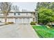 Attractive two-story townhome with a two-car garage and well-manicured lawn at 4083 Audubon Dr, Marietta, GA 30068