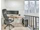 Modern home office features a wall of hexagonal panels, built-in desk, and comfortable office chair at 4083 Audubon Dr, Marietta, GA 30068