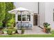 Private patio with seating for dining and potted plants at 416 Glen Iris Ne Dr, Atlanta, GA 30308