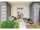 Modern front entryway with gray stone accents and lush landscaping at 416 Glen Iris Ne Dr, Atlanta, GA 30308