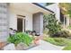 Stylish front entry with gray stone, landscaping, and a welcoming porch at 416 Glen Iris Ne Dr, Atlanta, GA 30308