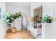 Bright hallway with light hardwood floors and plants at 416 Glen Iris Ne Dr, Atlanta, GA 30308