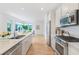 Modern kitchen with white cabinets and marble countertops at 416 Glen Iris Ne Dr, Atlanta, GA 30308