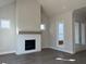 Bright living room featuring a white brick fireplace and hardwood floors at 519 Godfrey Dr, Cumming, GA 30040