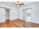 Spacious bedroom with hardwood floors and barn door leading to en-suite bathroom at 1120 Arlington Ave, Atlanta, GA 30310