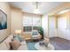 Bright living room featuring beige couch and comfy armchair at 315 Barshay Dr, Covington, GA 30016