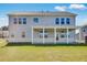 A spacious backyard featuring a covered patio perfect for outdoor entertaining at 6210 Misty Hill Ln, Buford, GA 30518