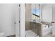 Clean, bright bathroom with a separate glass shower and tub perfect for relaxing at 6210 Misty Hill Ln, Buford, GA 30518