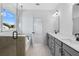 Modern bathroom with double sinks, quartz countertops, glass shower, and separate soaking tub at 6210 Misty Hill Ln, Buford, GA 30518