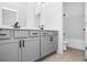 Contemporary bathroom showcasing double vanity, walk in shower and modern fixtures at 6210 Misty Hill Ln, Buford, GA 30518