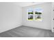 Bright bedroom with large windows offering neighborhood views at 6210 Misty Hill Ln, Buford, GA 30518