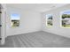 Bright bedroom featuring plush carpeting, recessed lighting, and scenic neighborhood views from its windows at 6210 Misty Hill Ln, Buford, GA 30518