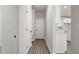 Hallway with light grey walls and hardwood floors at 6210 Misty Hill Ln, Buford, GA 30518