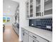 Contemporary kitchen with stainless steel appliances, quartz countertops, and sleek gray cabinets at 6210 Misty Hill Ln, Buford, GA 30518