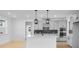 Modern kitchen with pendant lighting, an island, stainless steel appliances, and sleek gray cabinetry at 6210 Misty Hill Ln, Buford, GA 30518