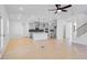 Bright kitchen with a large island, stainless steel appliances, pendant lights, and gray cabinetry at 6210 Misty Hill Ln, Buford, GA 30518