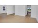 Open-concept living room with hardwood floors and plenty of natural light at 6210 Misty Hill Ln, Buford, GA 30518