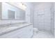 Bathroom boasts double vanity, granite countertop and tile shower at 1440 Fairview Rd, Ellenwood, GA 30294