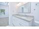 Double vanity bathroom with granite countertop and tile floor at 1440 Fairview Rd, Ellenwood, GA 30294