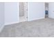 Bright bedroom with grey carpet and en-suite bathroom at 1440 Fairview Rd, Ellenwood, GA 30294