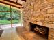 Stone fireplace with wood logs in a modern living room at 1719 Barnesdale Ne Way, Atlanta, GA 30309