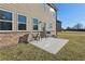 Back patio with chairs and grill, a nice spot for relaxation and outdoor dining at 1920 Pearson St, Loganville, GA 30052
