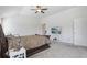 Bedroom showcasing the bed, ceiling fan, carpeting, and TV sitting on a modern console at 1920 Pearson St, Loganville, GA 30052