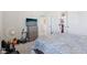 Bedroom featuring a fan, bed, dresser with a TV, and closet doors at 1920 Pearson St, Loganville, GA 30052