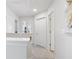 Second floor hallway featuring white walls, carpet, and doors at 1920 Pearson St, Loganville, GA 30052