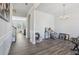 Bright living area boasts wood floors, ample natural light, and a staircase view at 1920 Pearson St, Loganville, GA 30052