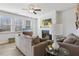 Comfortable living room features a cozy fireplace, ceiling fan, and stylish decor at 1920 Pearson St, Loganville, GA 30052