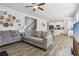 Open-concept living area seamlessly connects to the kitchen with wood floors and modern finishes at 1920 Pearson St, Loganville, GA 30052