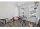 Living space with wood floors, many windows, and decorative trim at 1920 Pearson St, Loganville, GA 30052