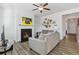Comfortable living room shows a fireplace, wood floors, and neutral colors at 1920 Pearson St, Loganville, GA 30052