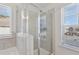 Modern bathroom featuring glass enclosed shower with tiled walls and neutral tones, bringing style and convenience at 1920 Pearson St, Loganville, GA 30052