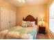 Bedroom with a queen bed, nightstand, and double door closet at 2063 Emily Dr, Social Circle, GA 30025