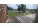 View of the back deck featuring wooden railing and fence overlooking a grassy area at 1294 Dogwood Rd, Snellville, GA 30078