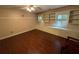 Bedroom with built-in shelving and wood-look flooring at 1294 Dogwood Rd, Snellville, GA 30078