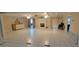 Large common area with tiled floors, fireplace and access to other rooms at 1294 Dogwood Rd, Snellville, GA 30078