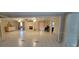 Large common area with tiled floors, fireplace and access to other rooms at 1294 Dogwood Rd, Snellville, GA 30078